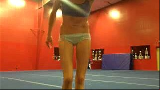 My girlfriend is a talented gymnast who made this video for me of her performing naked and then working her tight teen vagina with a toy.
